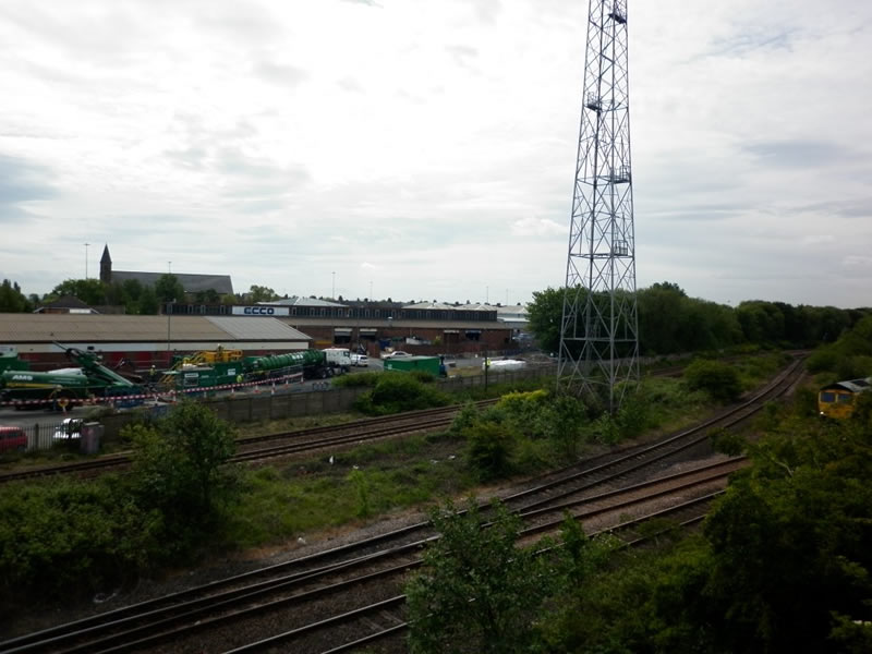 The drill site beyond the live railway lines from the swing bridge