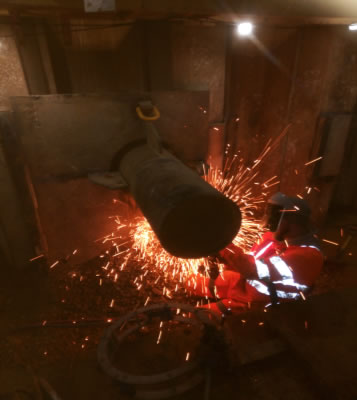 Steel casing pipe being welded prior to ramming